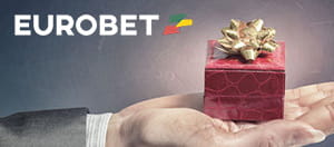 Un pacco sorpresa e a sinistra il logo del casinò Eurobet.