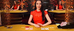 Una croupier del gioco Punto Banco live